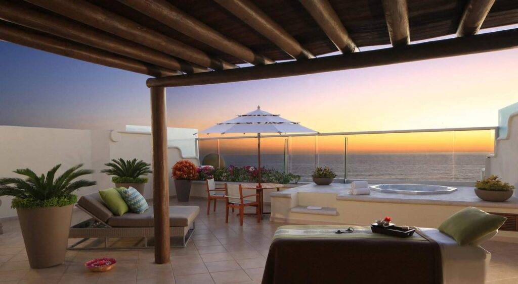resort patio overlooking ocean at sunset