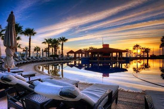 resort pool at sunset