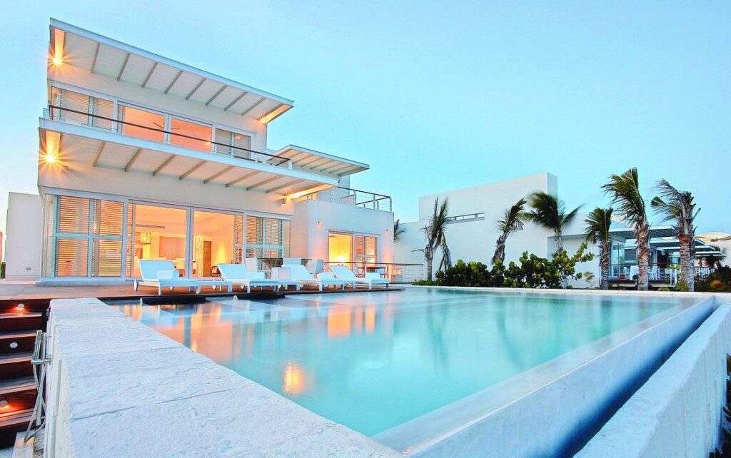 resort pool with white building